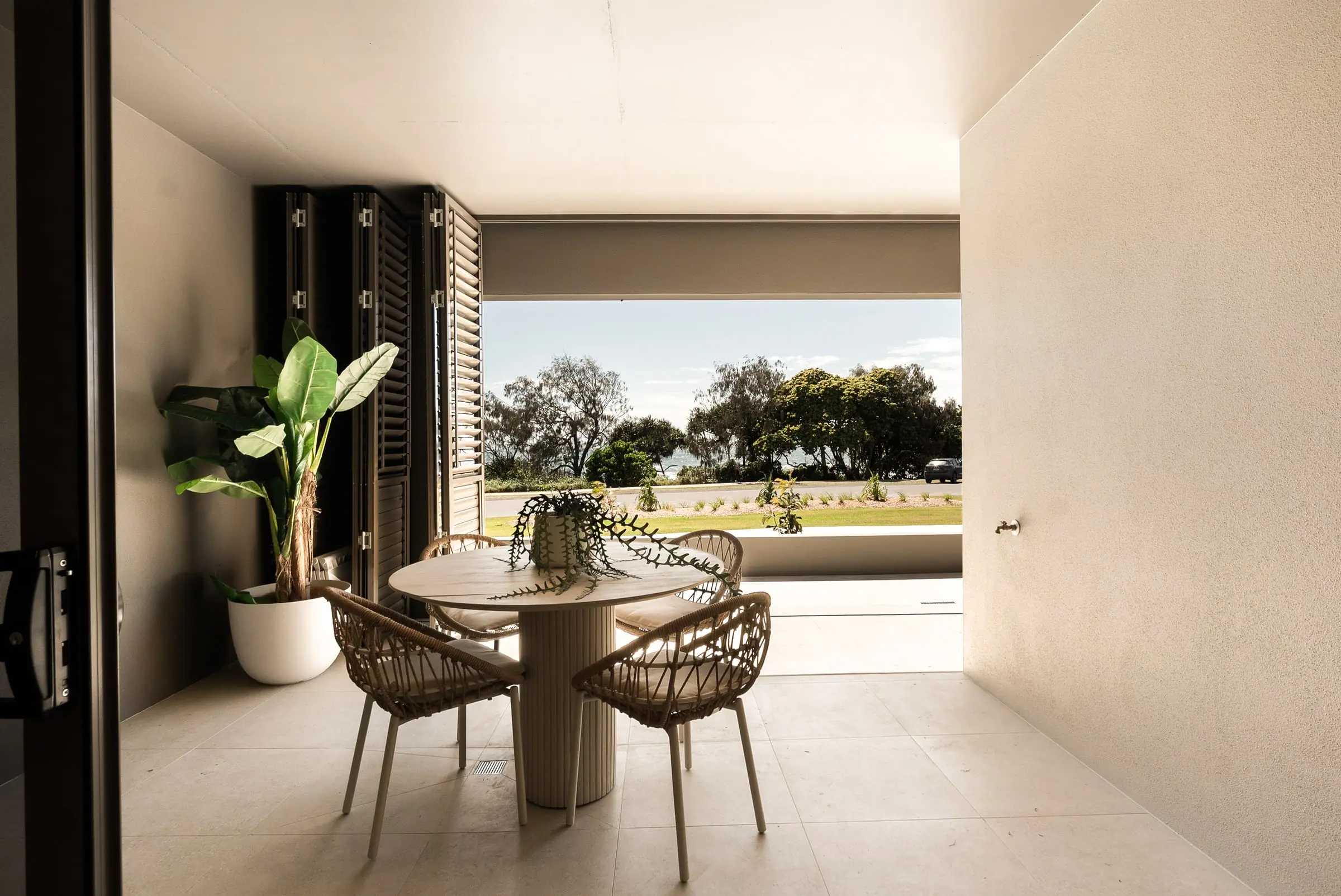 Balcony dining looking over the Esplanade parkland to the sea
