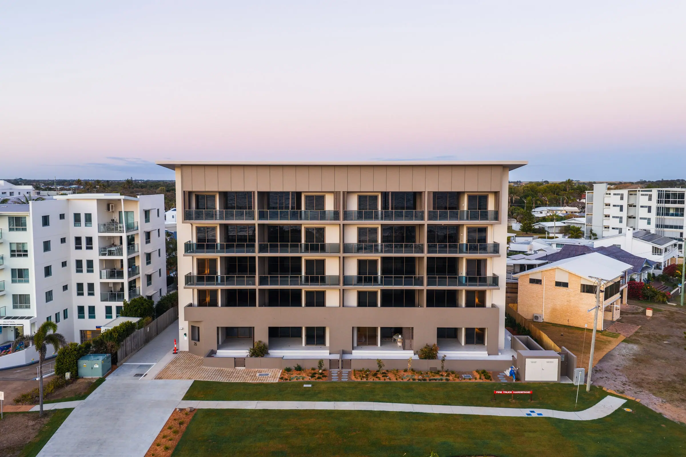Mira Living at dusk, from the air above the Esplanade